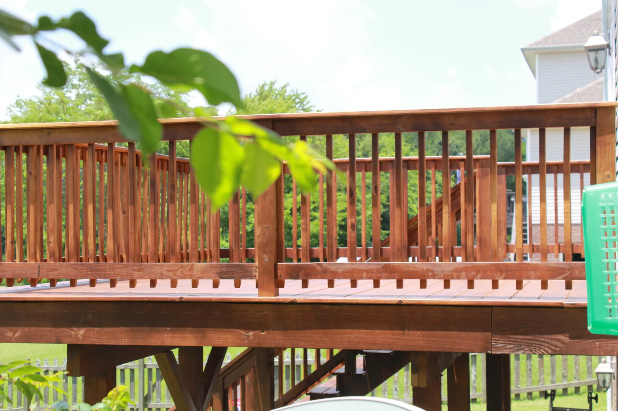 Finished stained wood custom deck and railing project in Clarksville, TN